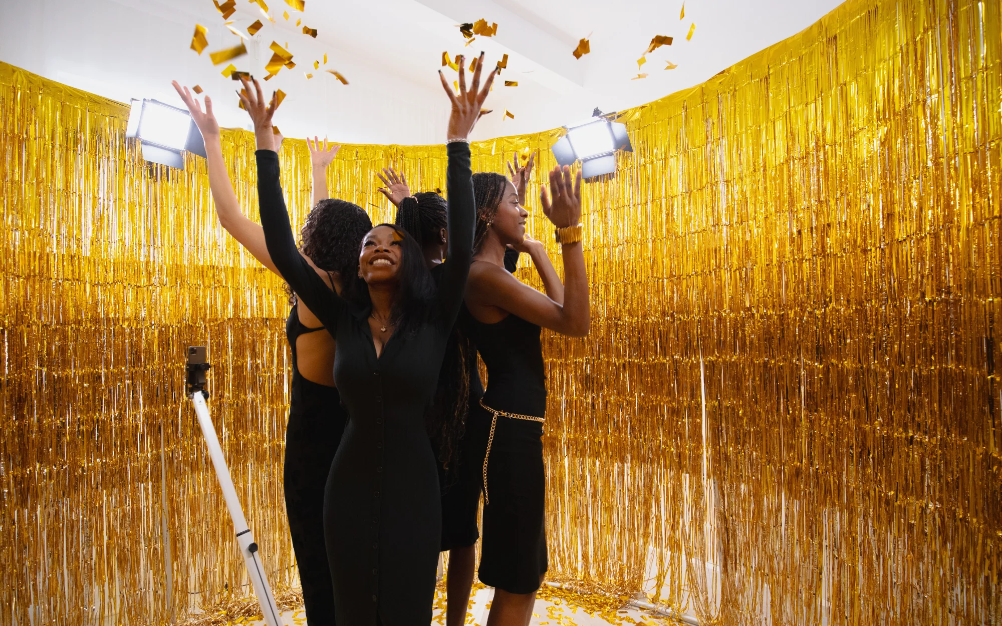 360 photo booth in Bend with gold backdrop and confetti