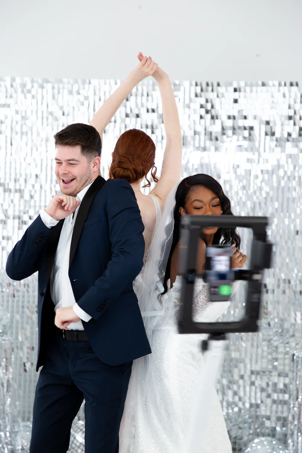 360 photo booth at a Bend, Oregon wedding with silver sequin backdrop