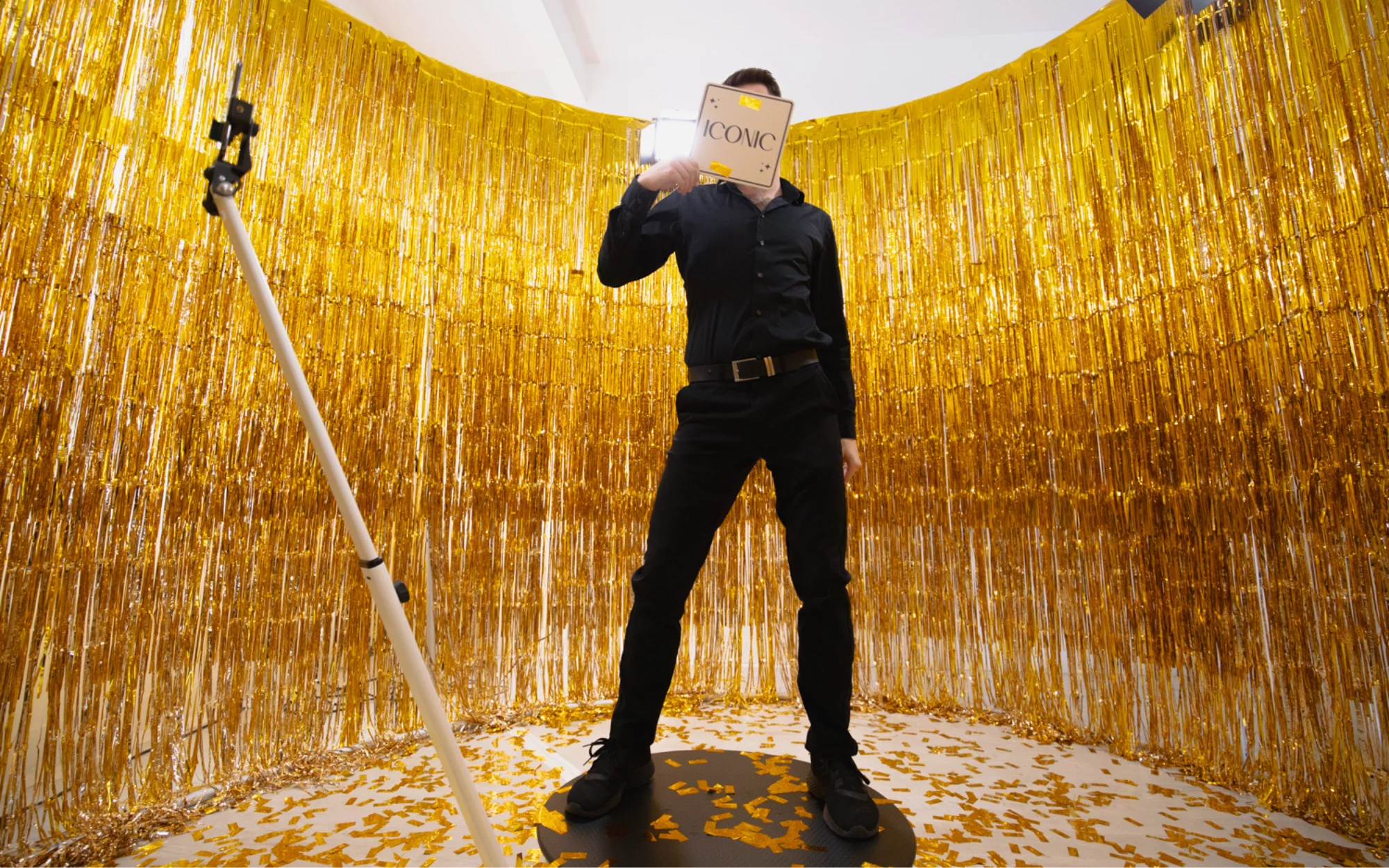 360 photo booth rental in Bend with gold tinsel curtain and confetti