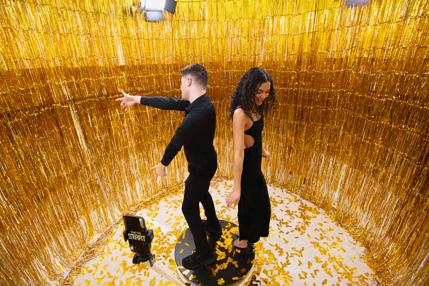 360 photo booth video capture inside gold tinsel enclosure
