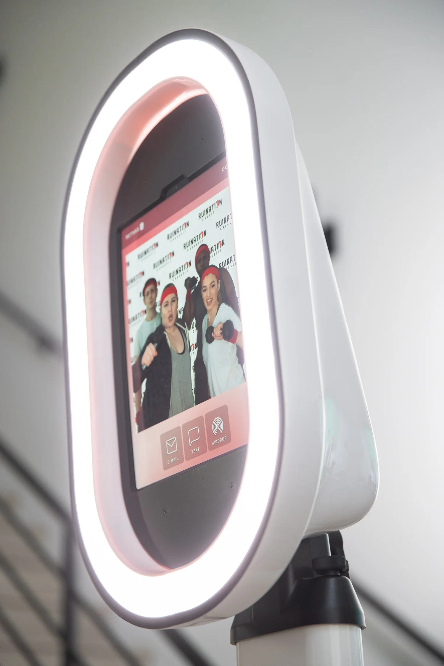 Guests laughing inside a private event photo booth rental in Bend, Oregon