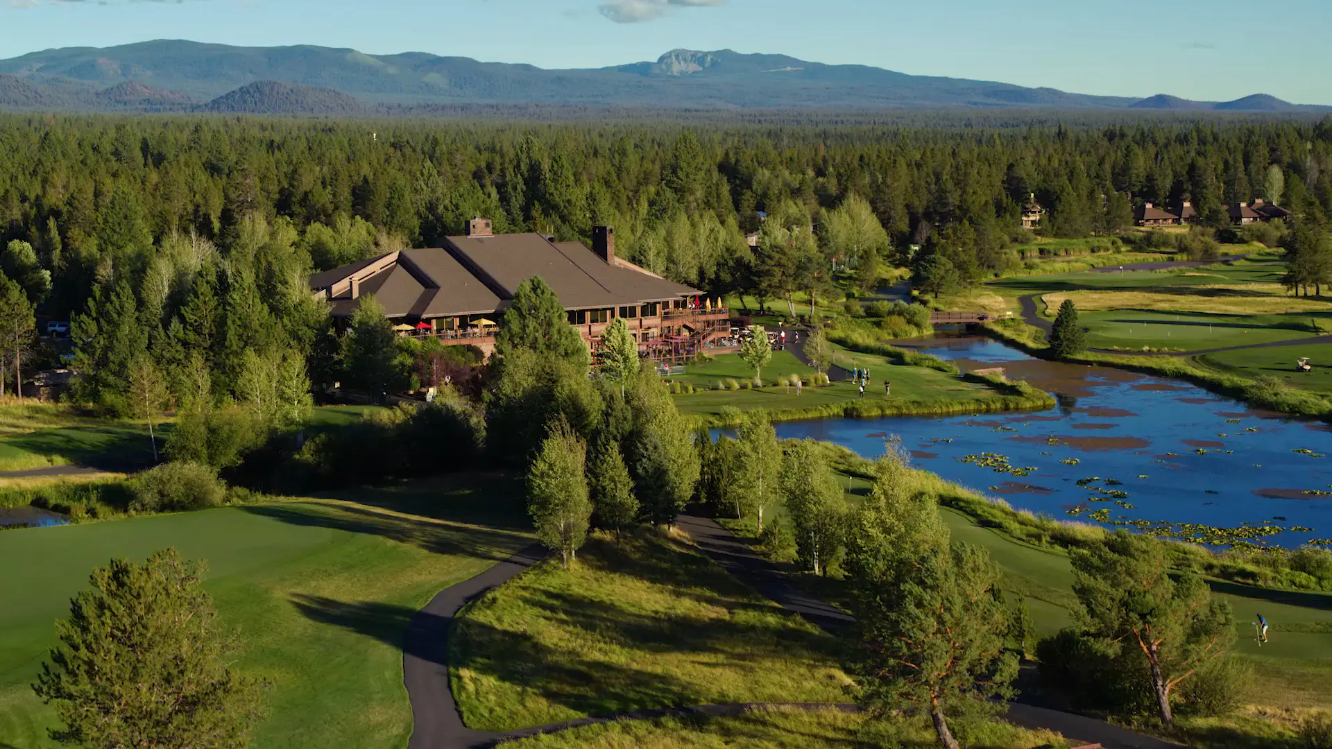 Sunriver Resort lodge and meadow along the Deschutes River surrounded by ponderosa pines